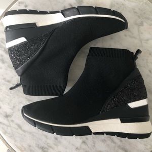 The Wishbone CollectionSz 6.5 slip on hidden wedge ankle boot.